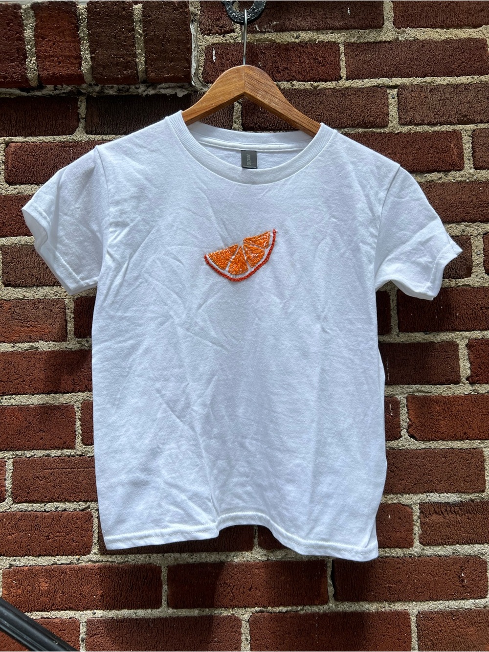 White Baby Tee with Hand Stitched Orange Slice Embroidery